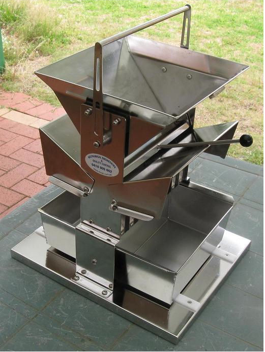 Shown with the dust hoods open and carrying handle upright.